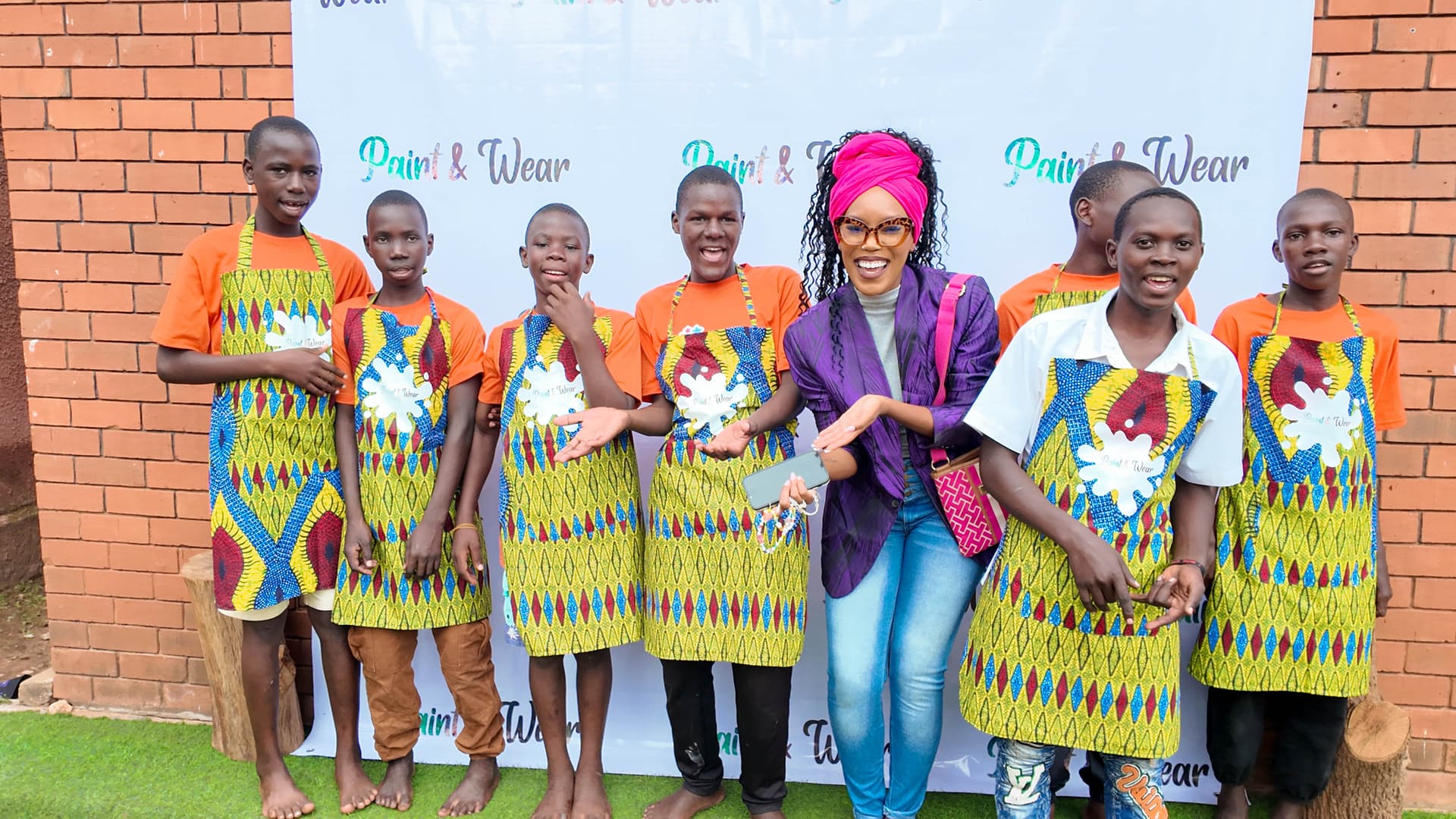 Boys presenting their Paint & Wear designs
