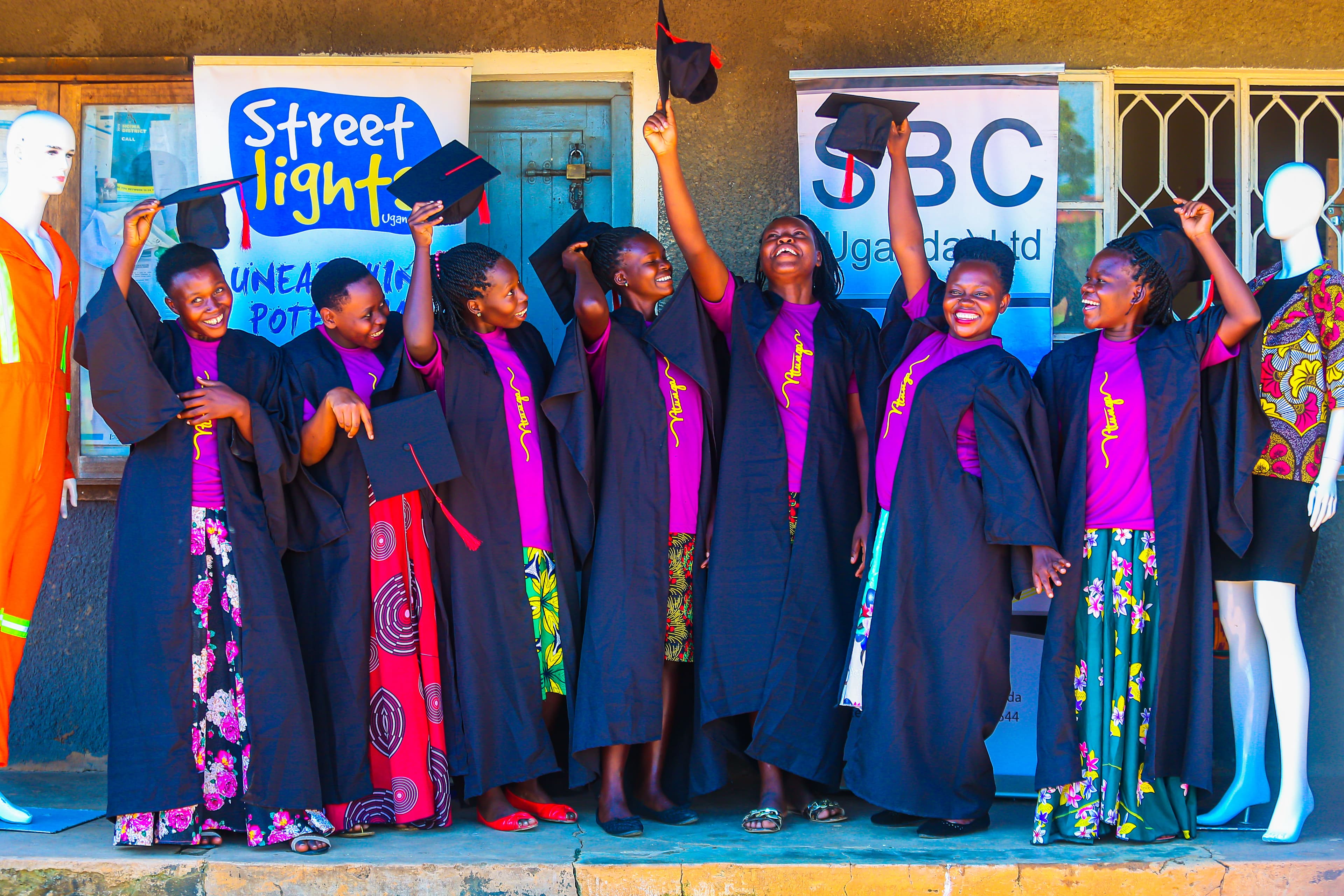 Graduates displaying handmade products